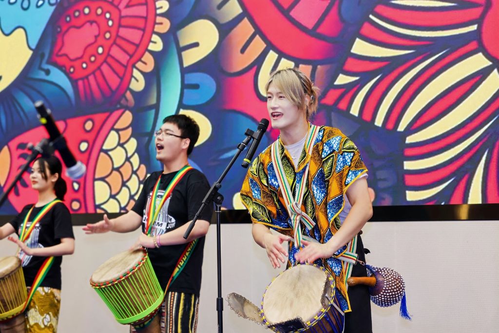 Performers playing djembe drums at a Zhejiang Innovation Tour cultural celebration