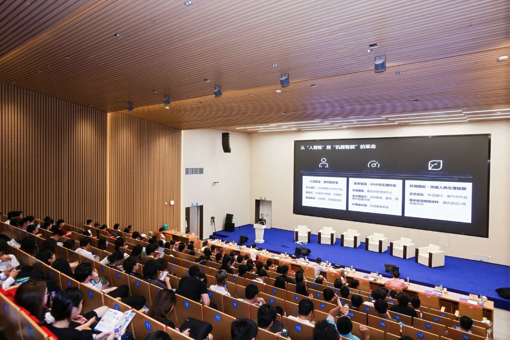 Wide shot of a packed lecture hall during the Zhejiang Innovation Tour keynote